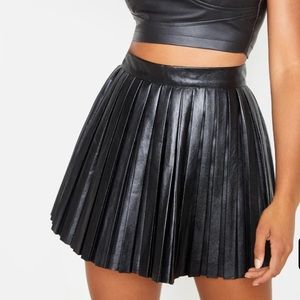 Black leather pleaded skirt